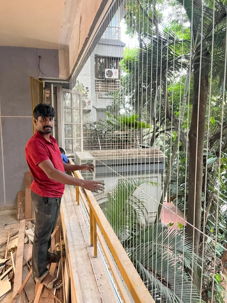 Invisible grill installation on high-rise balcony